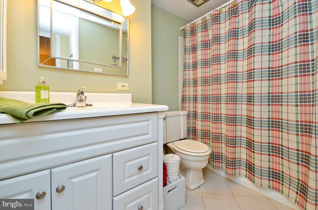 5235 West Running Brook Road, Unit 102 Columbia, MD 21044 - Photo 22 of 28 a bathroom with a sink toilet and shower
