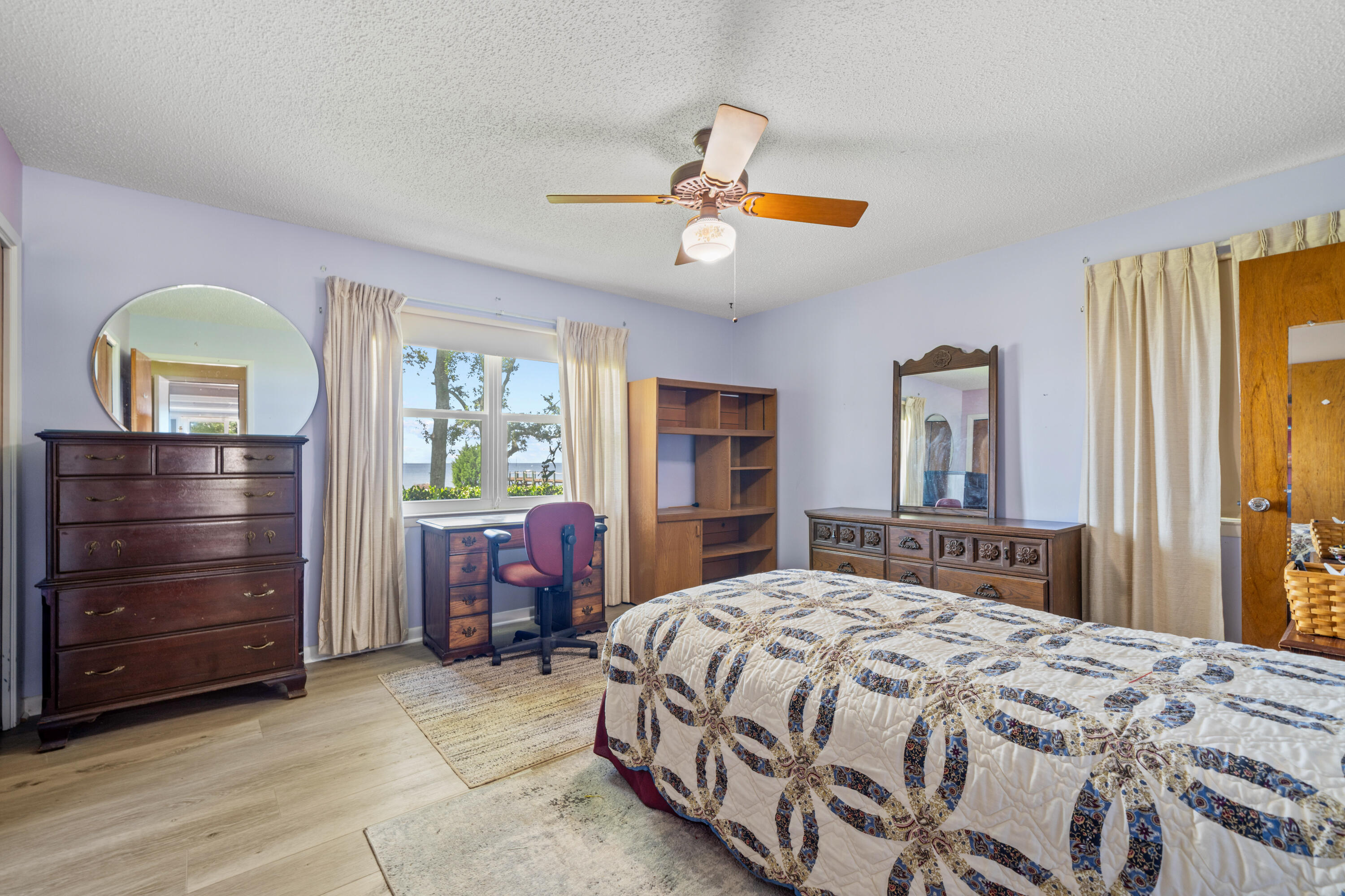 2744 Bay Grove Road Freeport, FL 32439 - Photo 19 of 45 a bedroom with a bed and a dresser
