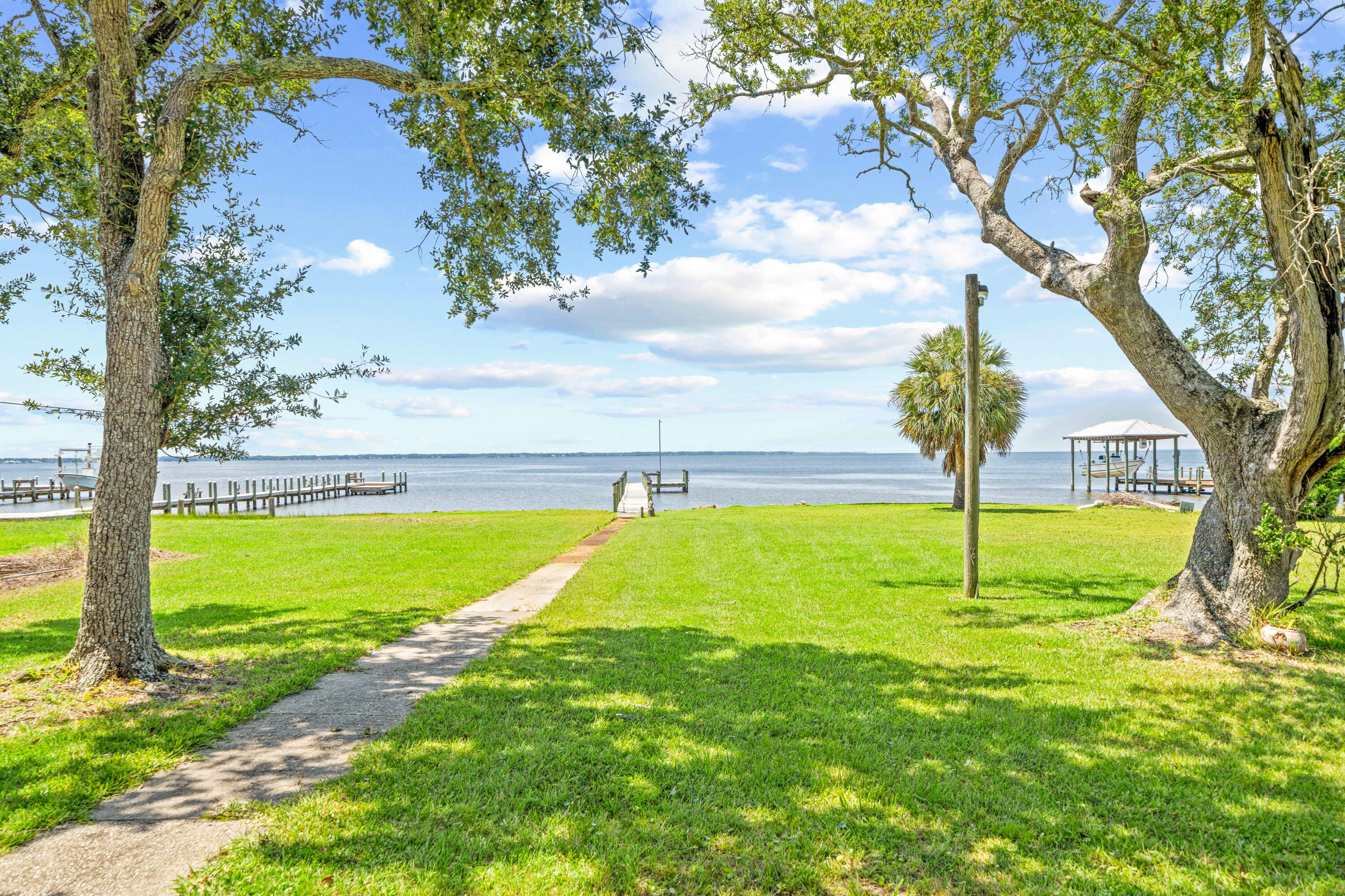2744 Bay Grove Road Freeport, FL 32439 - Photo 29 of 45 a view of an outdoor space and swimming pool