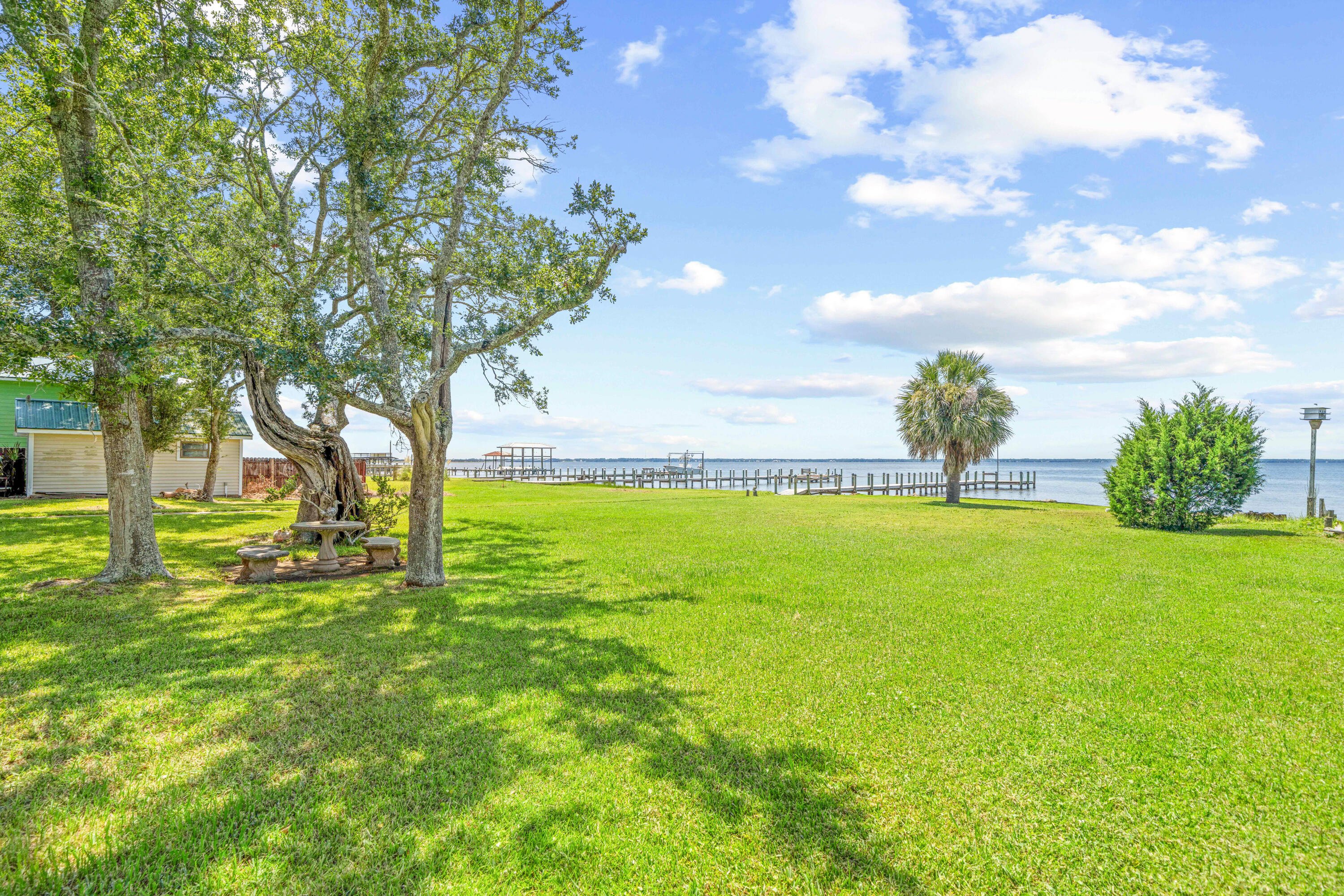 2744 Bay Grove Road Freeport, FL 32439 - Photo 31 of 45 a view of yard with swimming pool and green space
