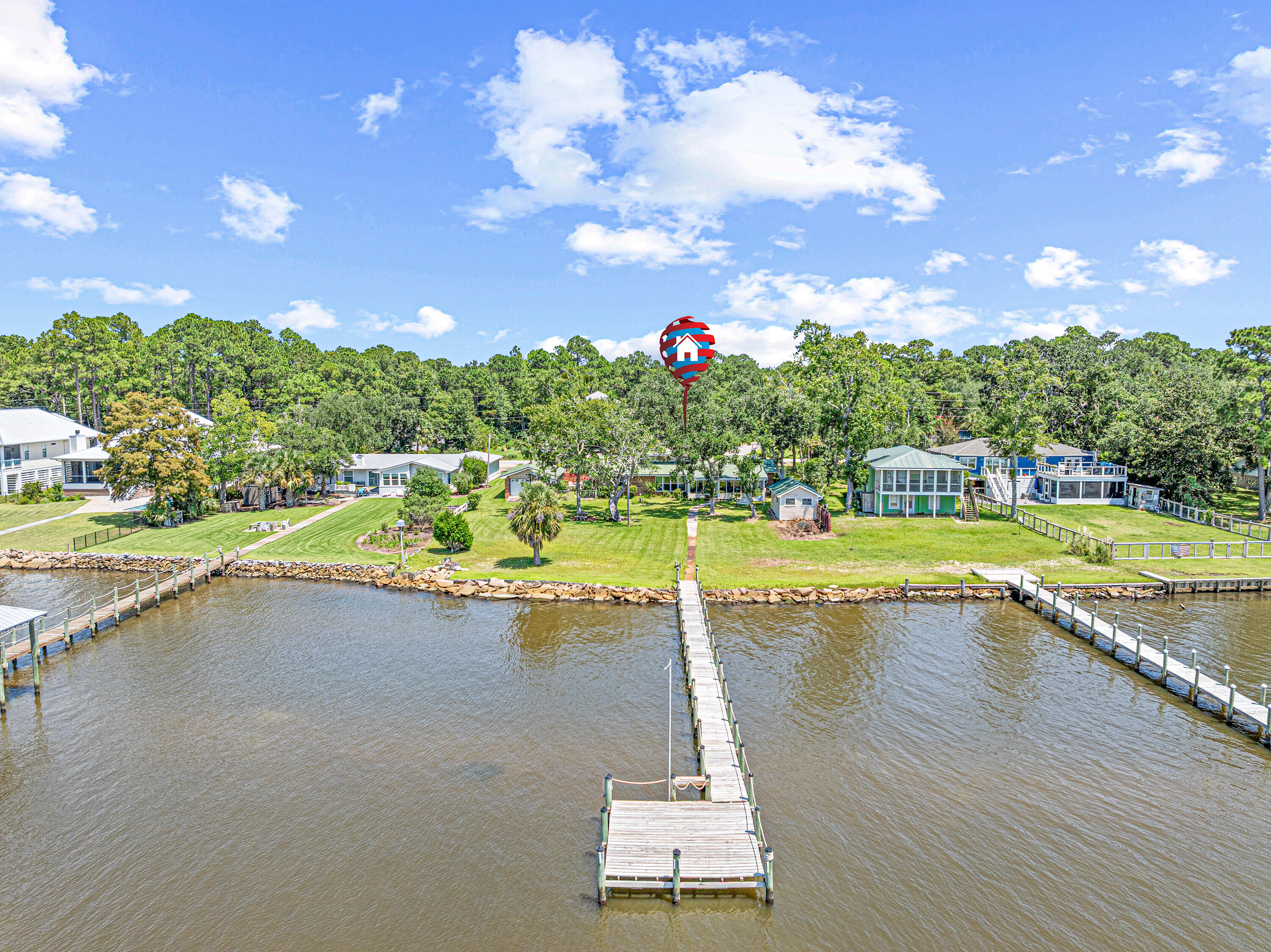 2744 Bay Grove Road Freeport, FL 32439 - Photo 4 of 45 a view of a swimming pool and trees in the background