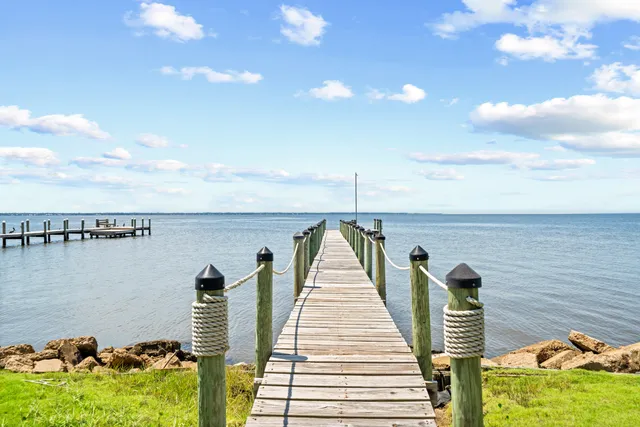 a view of a balcony and floor to ceiling windows