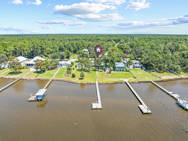 a view of a swimming pool and an outdoor seating