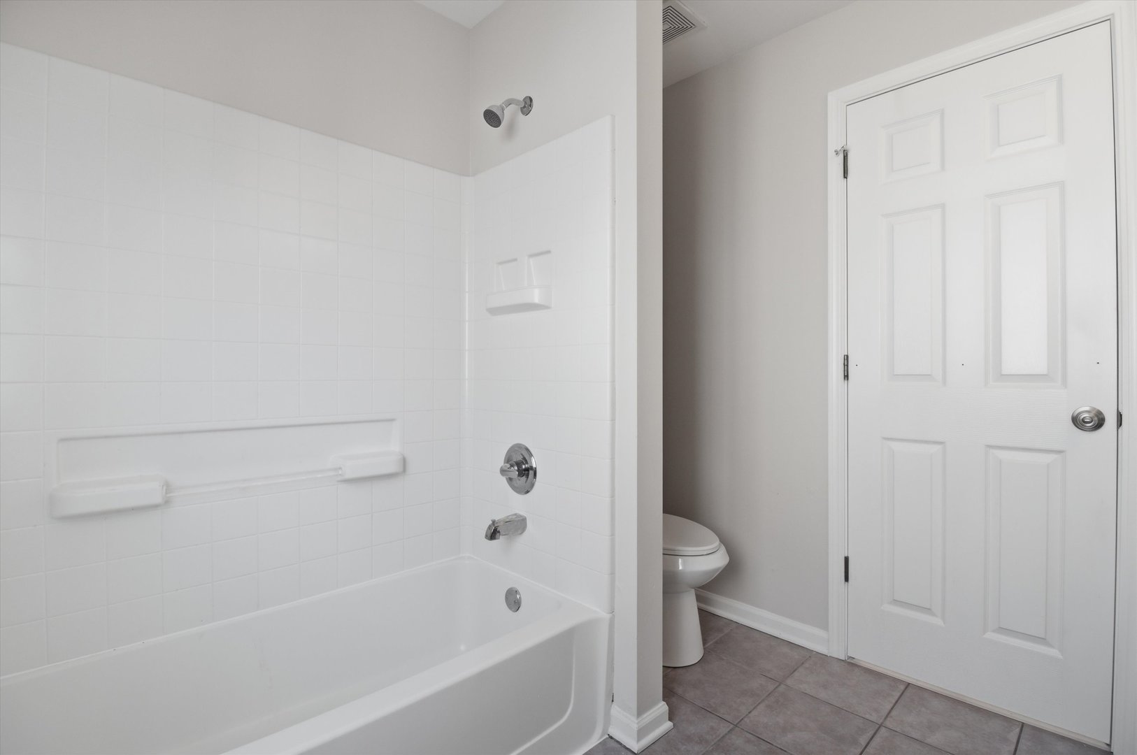 2511 Hennig Road Hampshire, IL 60140 - Photo 14 of 44 a bathroom with a bathtub and a toilet