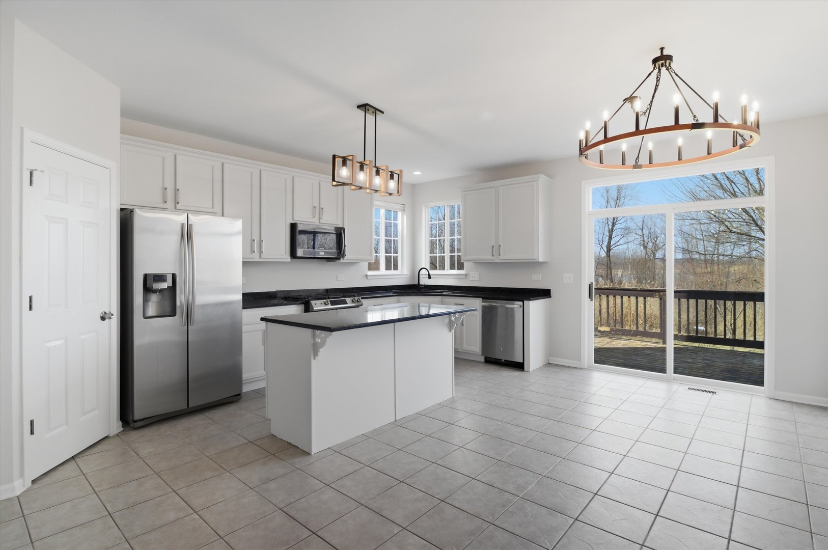 2511 Hennig Road Hampshire, IL 60140 - Photo 5 of 44 a kitchen with stainless steel appliances a sink stove and refrigerator