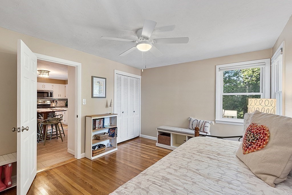 10 Truro Street Worcester, MA 01603 - Photo 12 of 32 a bedroom with a bed and wooden floor