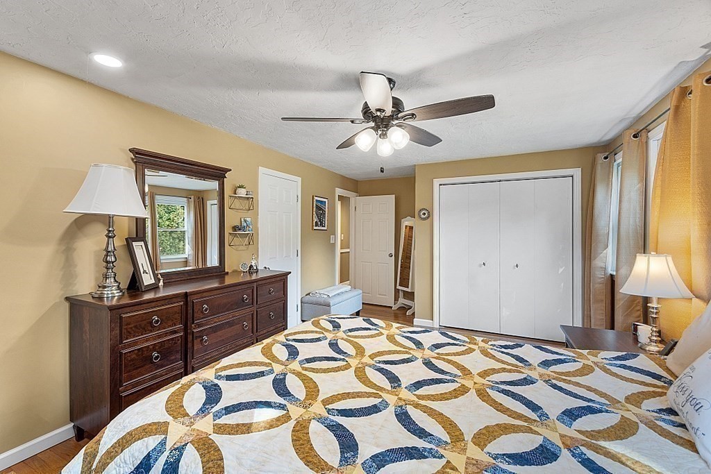 10 Truro Street Worcester, MA 01603 - Photo 17 of 32 a bedroom with a bed and a dresser