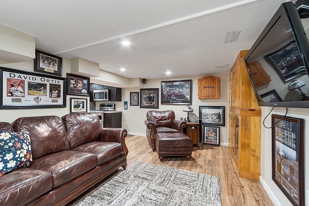 10 Truro Street Worcester, MA 01603 - Photo 19 of 32 a living room with furniture and a fireplace