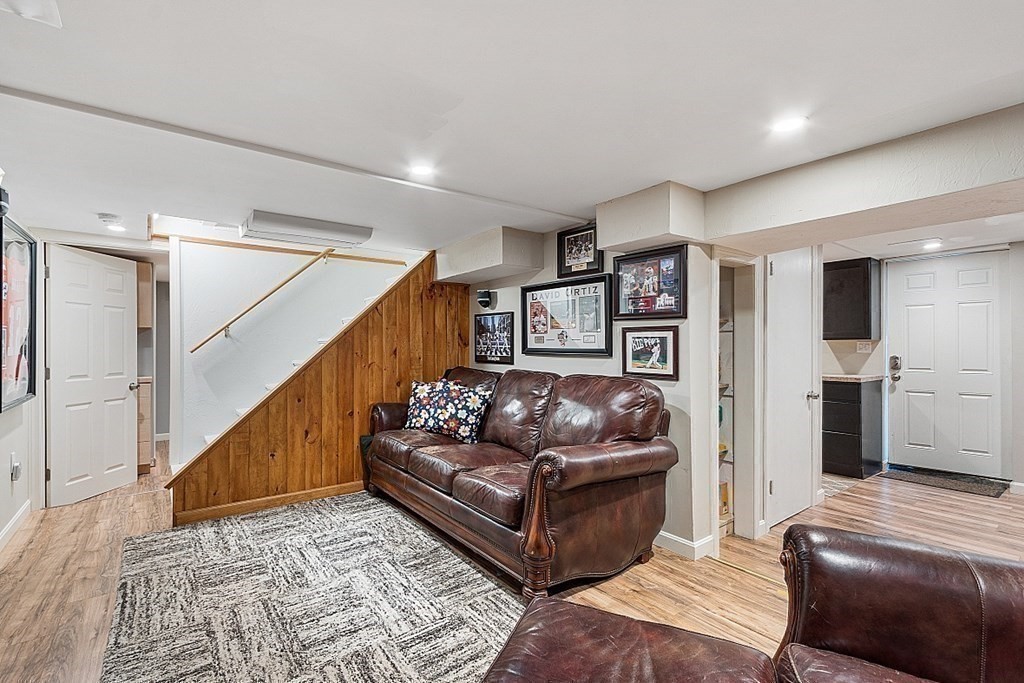10 Truro Street Worcester, MA 01603 - Photo 20 of 32 a living room with furniture and stairs