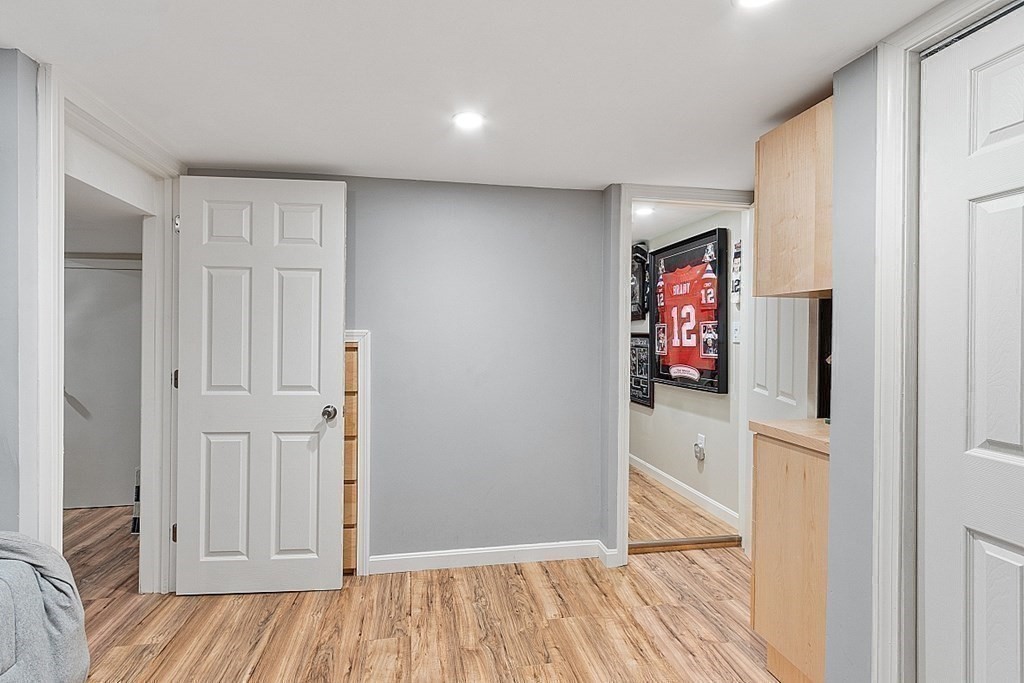 10 Truro Street Worcester, MA 01603 - Photo 26 of 32 a view of a hallway with wooden floor and closet