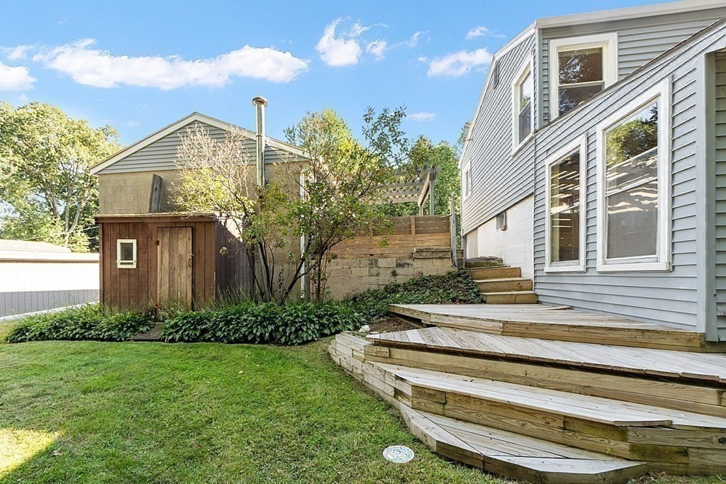 10 Truro Street Worcester, MA 01603 - Photo 29 of 32 a view of a house with a small yard and plants