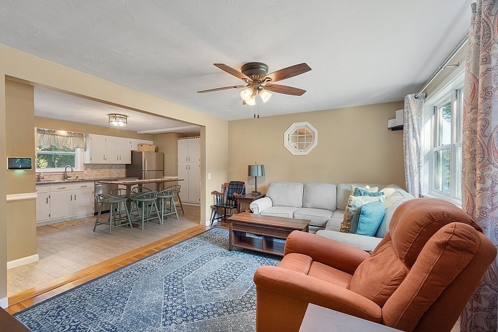 10 Truro Street Worcester, MA 01603 - Photo 9 of 32 a living room with furniture a ceiling fan and a rug