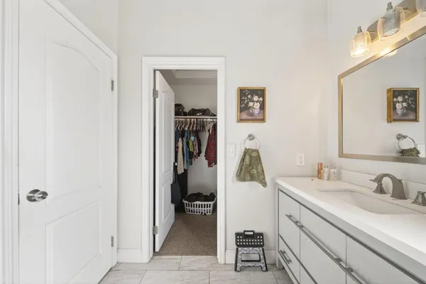 a en suite bathroom with a sink a mirror and a toilet
