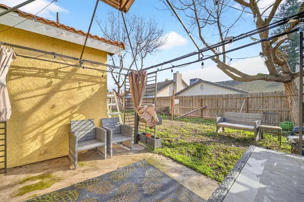 a wooden bench sitting in front of a building