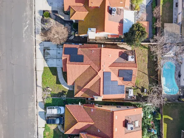 an aerial view of residential houses with outdoor space