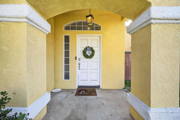 a front door view of a house with windows