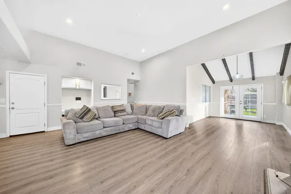a living room with furniture and a large window