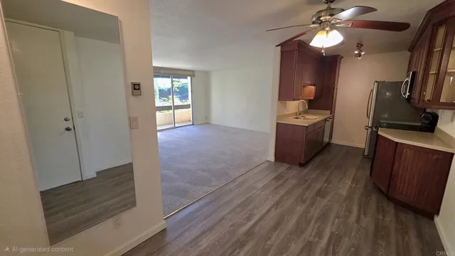 a view of a kitchen from the hallway