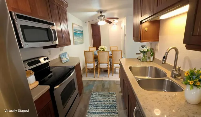 a kitchen with a sink and a microwave