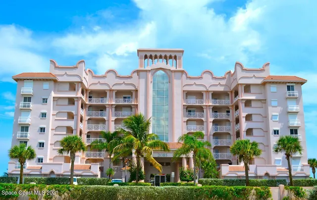 a front view of a building with garden