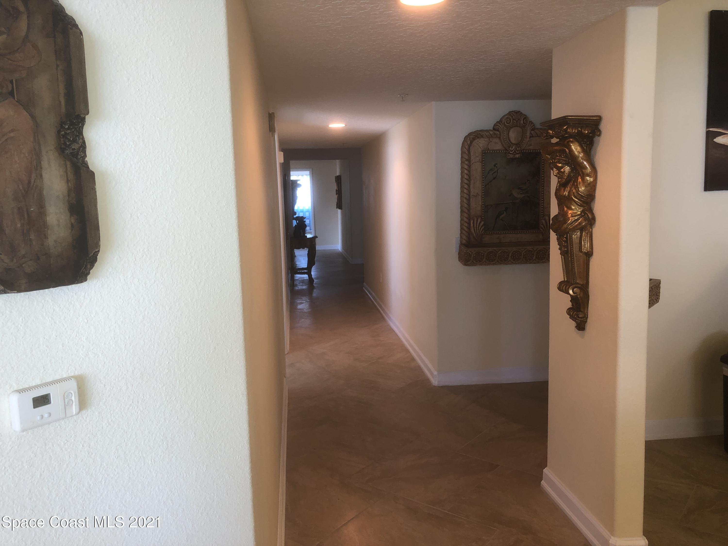 2075 Florida A1A, Unit 2705 Indian Harbour Beach, FL 32937 - Photo 8 of 30 a view of a hallway with a room