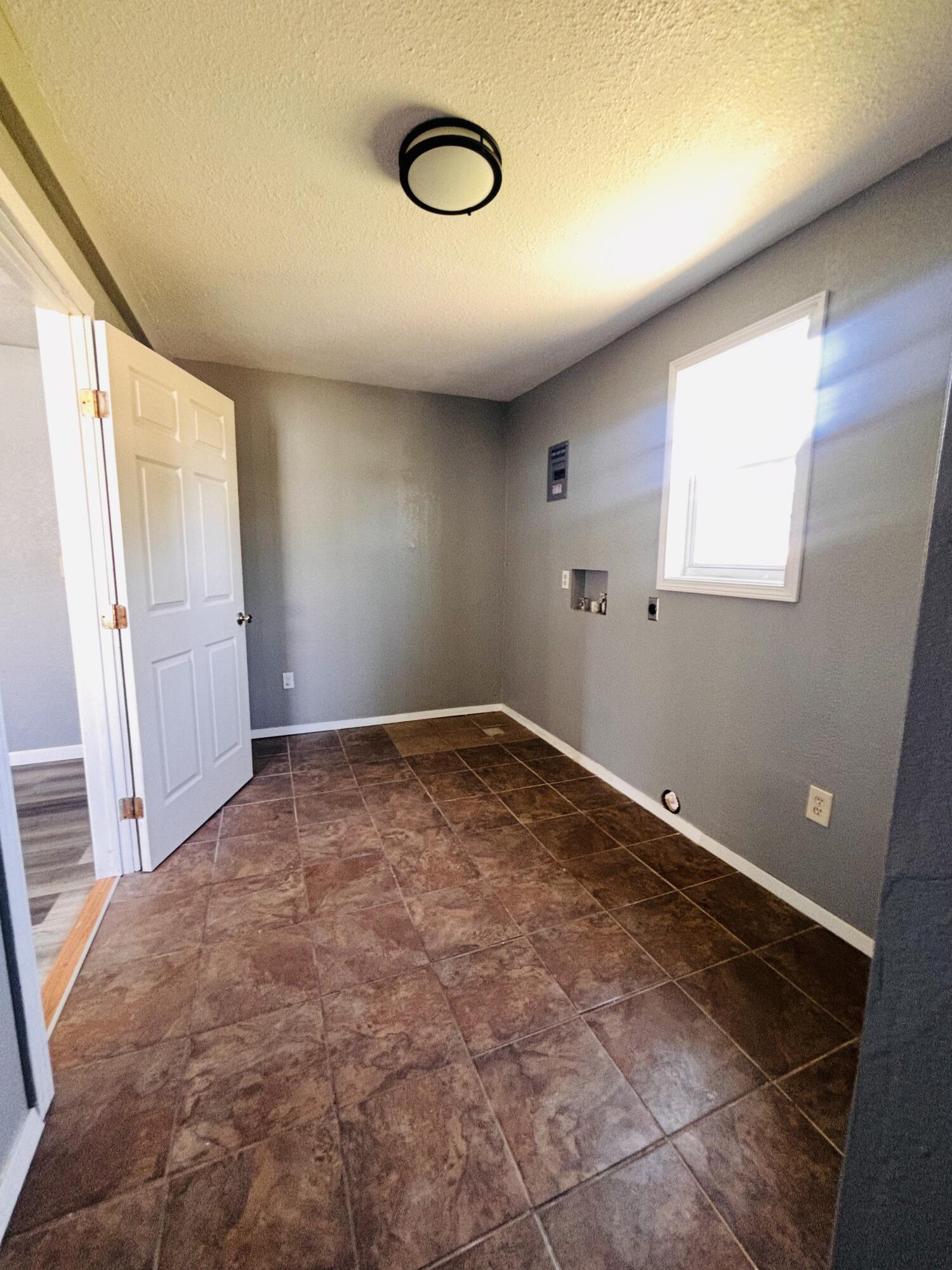 1108 41st Street Lubbock, TX 79412 - Photo 11 of 21 an empty room with windows
