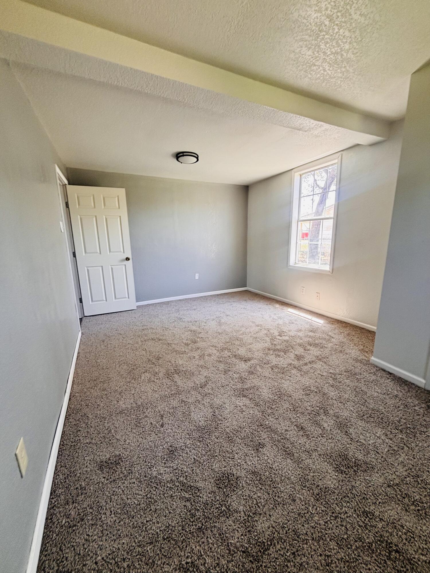 1108 41st Street Lubbock, TX 79412 - Photo 15 of 21 an empty room with windows