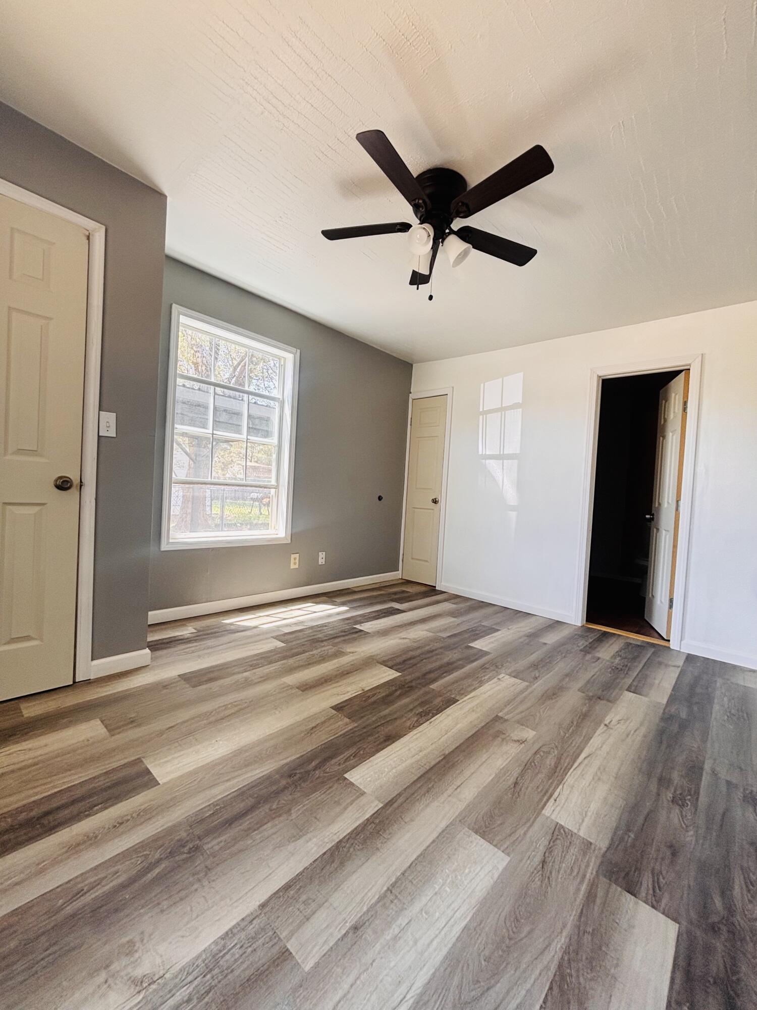 1108 41st Street Lubbock, TX 79412 - Photo 20 of 21 a view of a livingroom with a ceiling fan and window