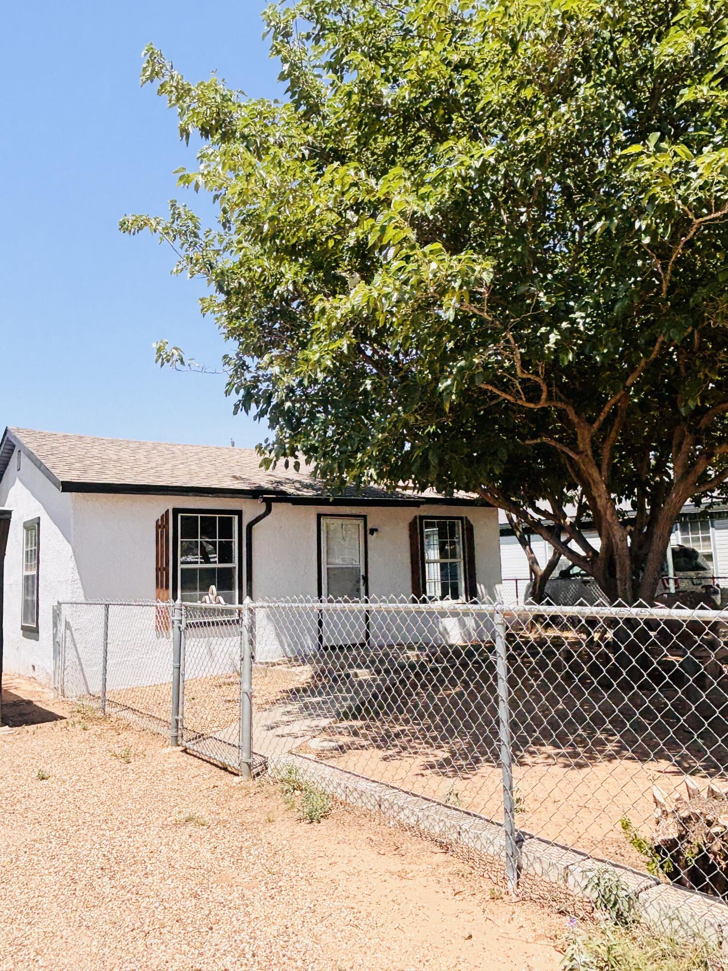 1108 41st Street Lubbock, TX 79412 - Photo 4 of 21 a front view of a house with a tree