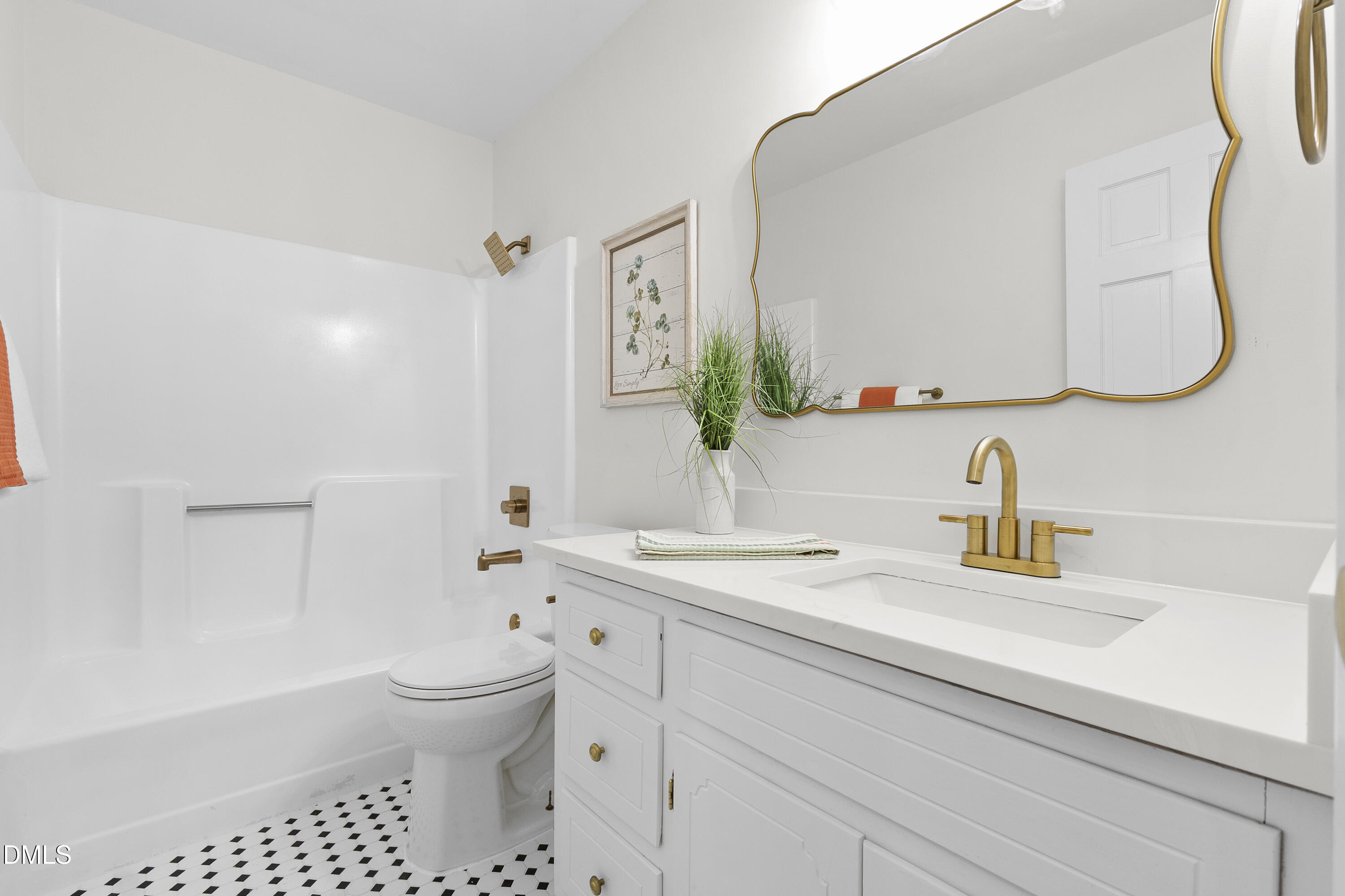 2168 Lakewood Falls Road Goldston, NC 27252 - Photo 19 of 30 a bathroom with a sink a toilet and a mirror