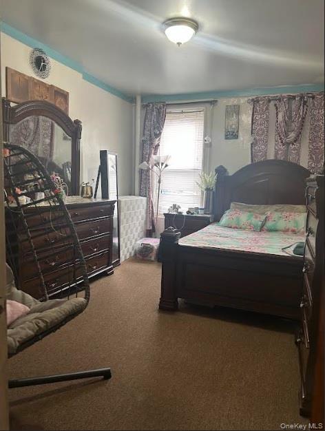 86-37 80th Street Queens, NY 11421 - Photo 4 of 5 Bedroom featuring carpet floors