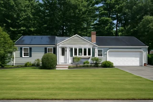 a front view of a house with a yard