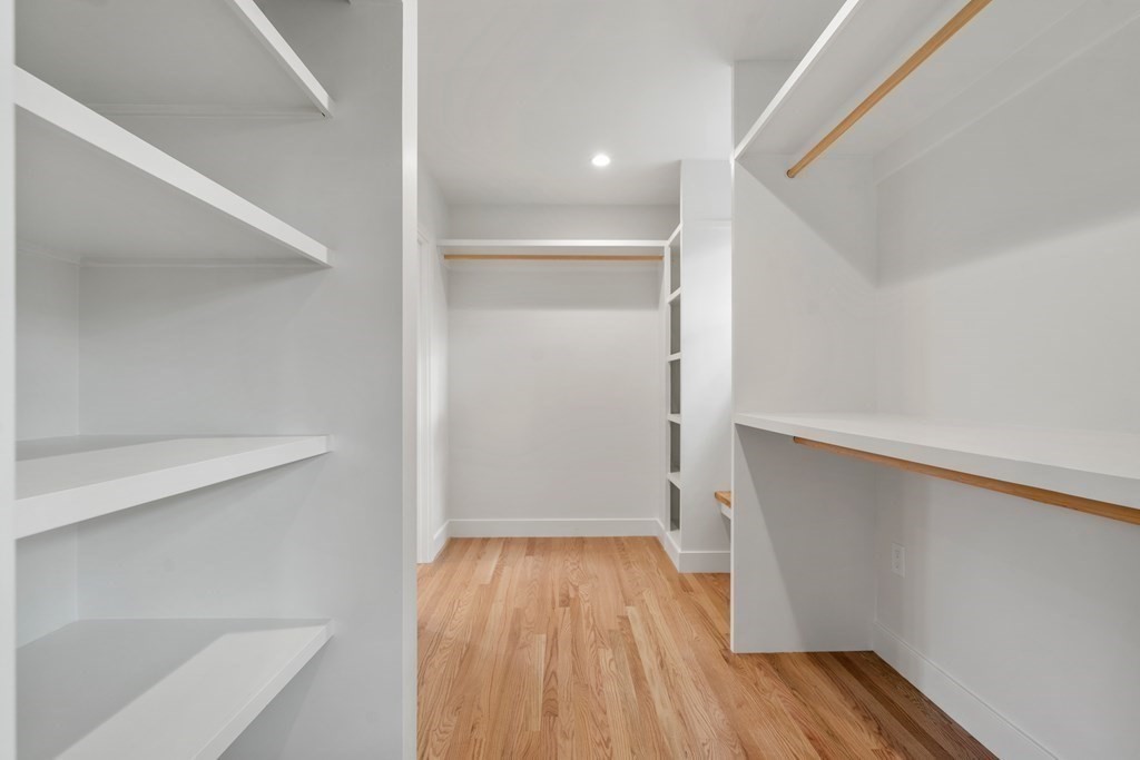 28 Tyler Road Belmont, MA 02478 - Photo 16 of 25 a view of walk in closet with wooden floor
