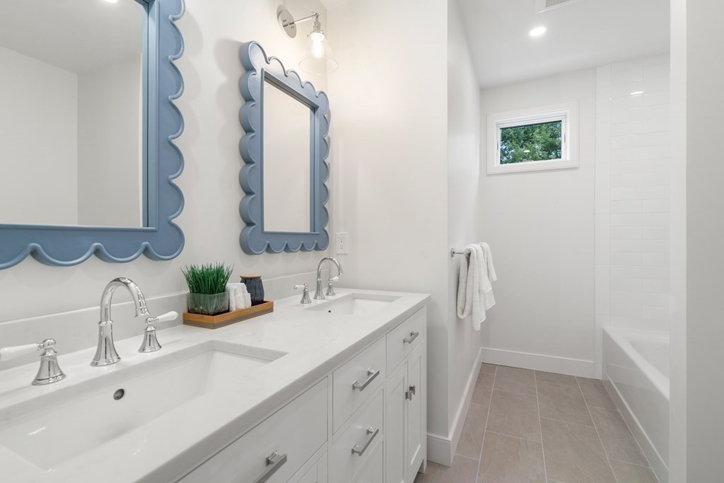 28 Tyler Road Belmont, MA 02478 - Photo 19 of 25 a bathroom with a double vanity sink mirror and