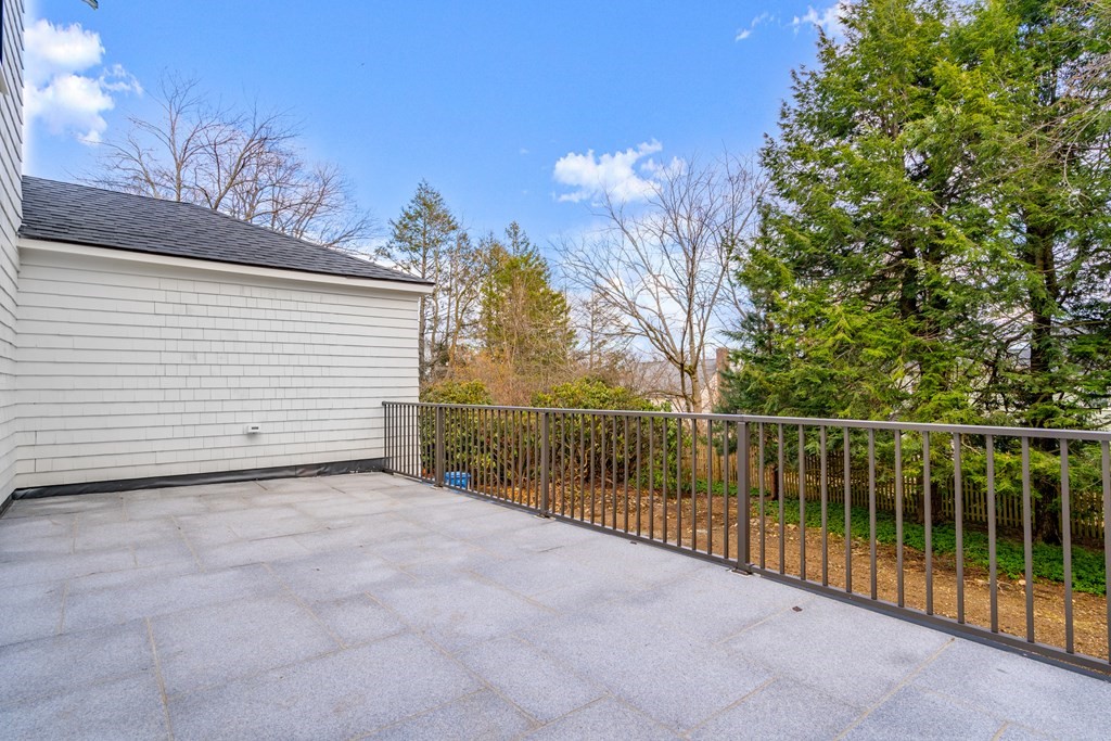 28 Tyler Road Belmont, MA 02478 - Photo 24 of 25 a view of a balcony with a tree