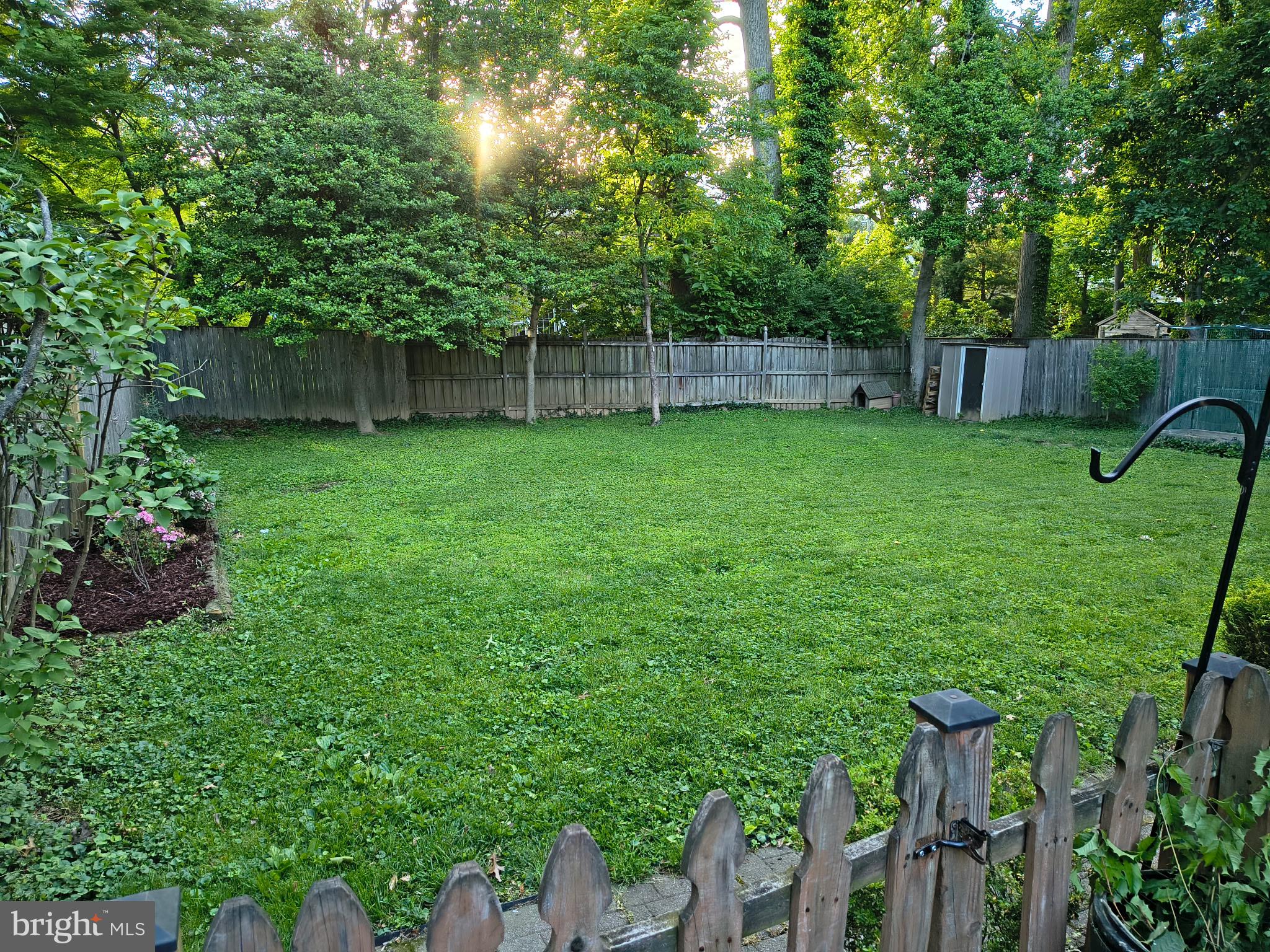 9316 Sudbury Road Silver Spring, MD 20901 - Photo 16 of 19 a view of yard with green space and wooden fence