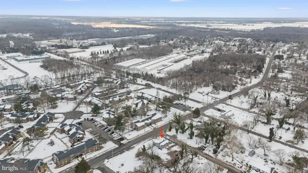 an aerial view of residential building with parking