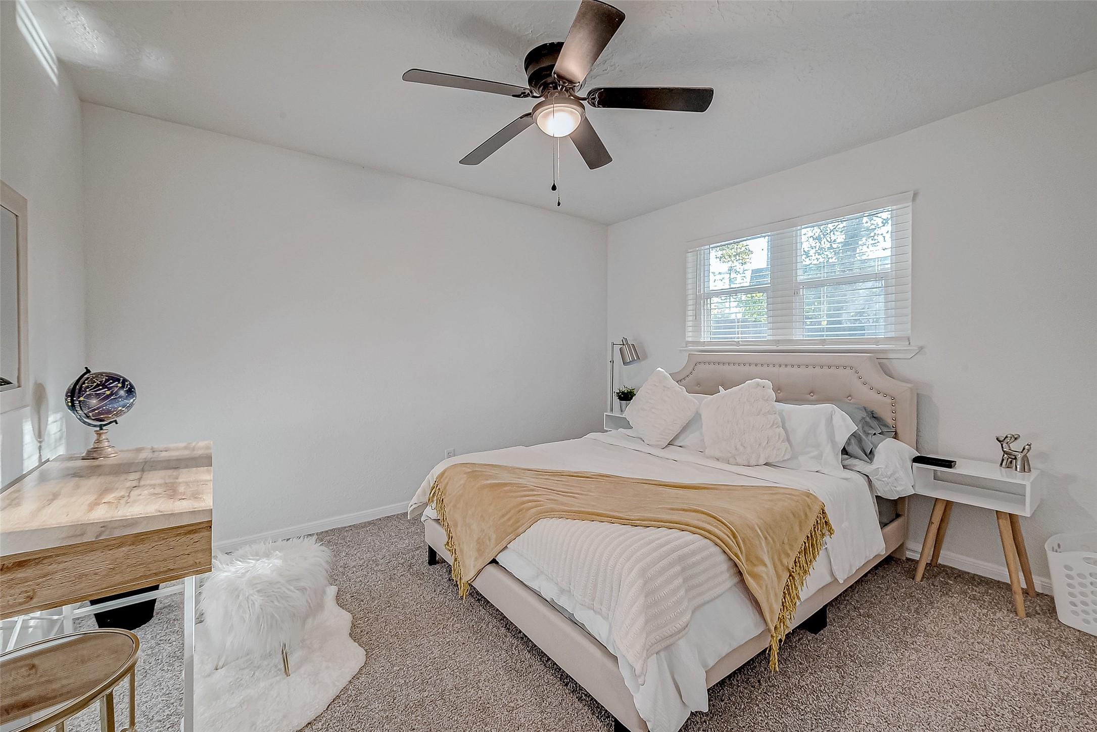 17431 Typhoon Way Crosby, TX 77532 - Photo 18 of 34 a bedroom with a bed and a chandelier