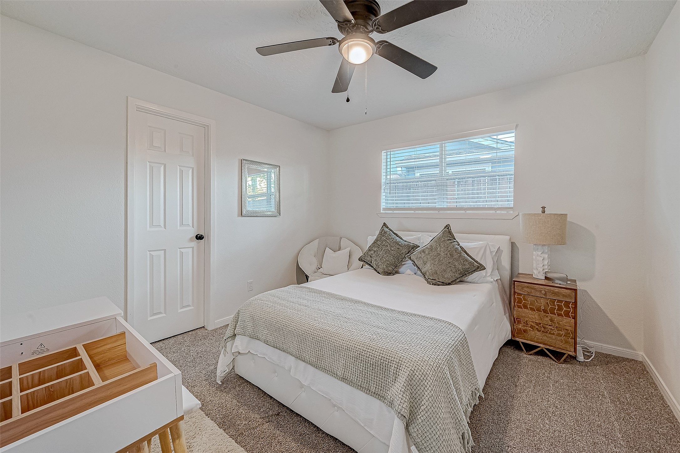 17431 Typhoon Way Crosby, TX 77532 - Photo 19 of 34 a bedroom with bed and window