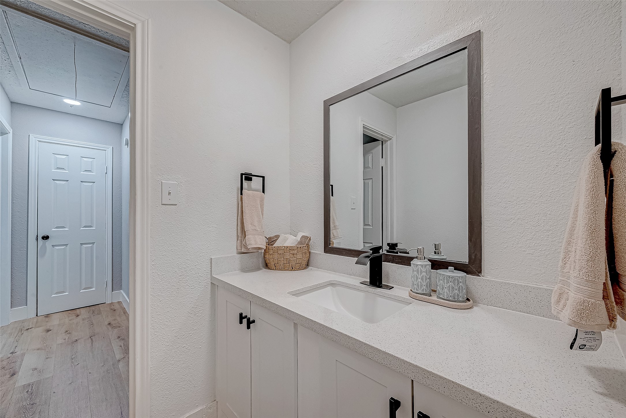 17431 Typhoon Way Crosby, TX 77532 - Photo 20 of 34 a bathroom with double vanity sinks and a mirror