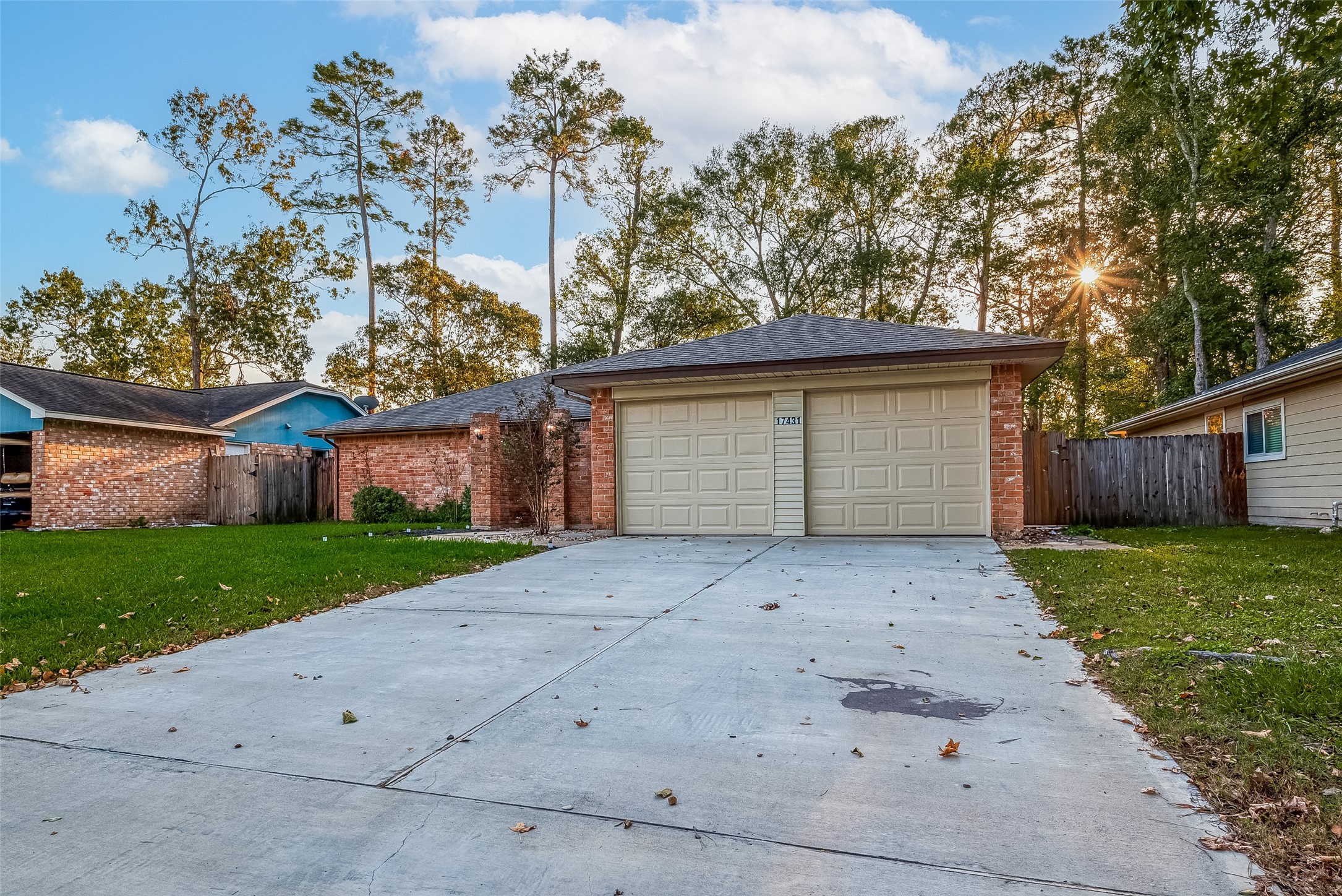 17431 Typhoon Way Crosby, TX 77532 - Photo 2 of 34 a front view of a house with a yard and garage