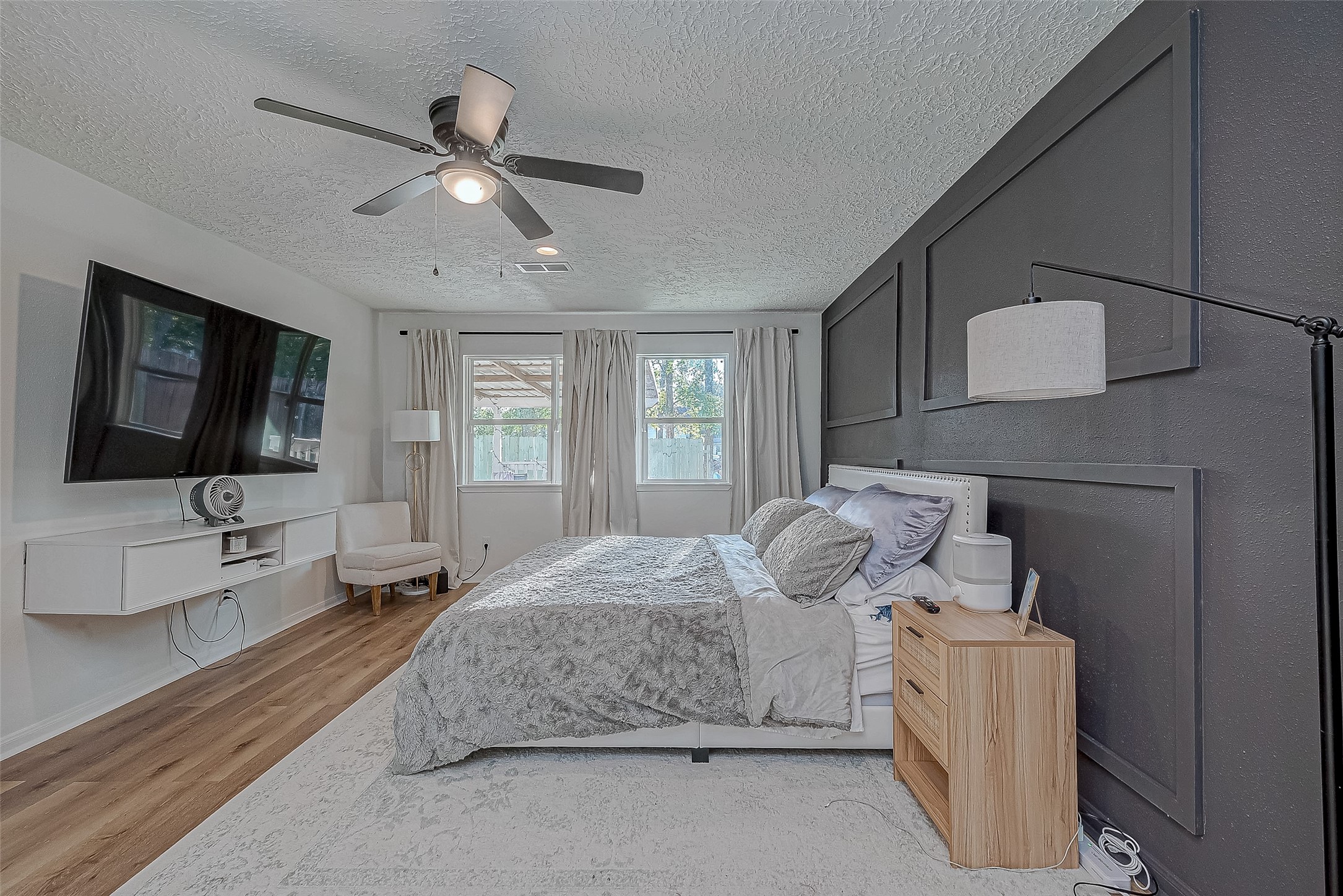 17431 Typhoon Way Crosby, TX 77532 - Photo 27 of 34 a bedroom with a bed and a flat screen tv