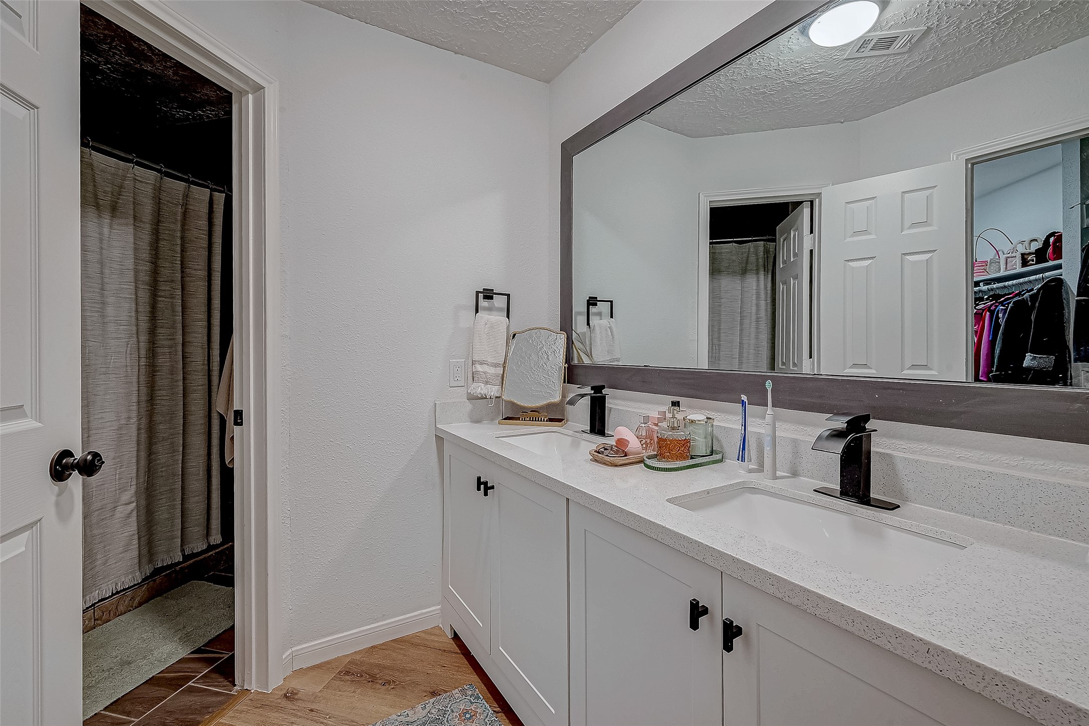 17431 Typhoon Way Crosby, TX 77532 - Photo 28 of 34 a bathroom with a sink and a mirror