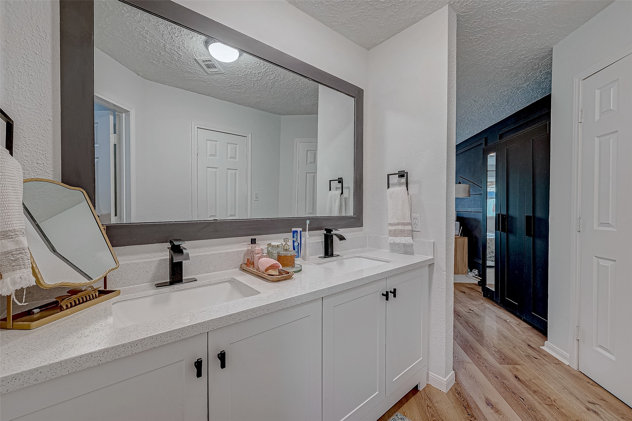 17431 Typhoon Way Crosby, TX 77532 - Photo 29 of 34 a bathroom with a sink double vanity and a mirror