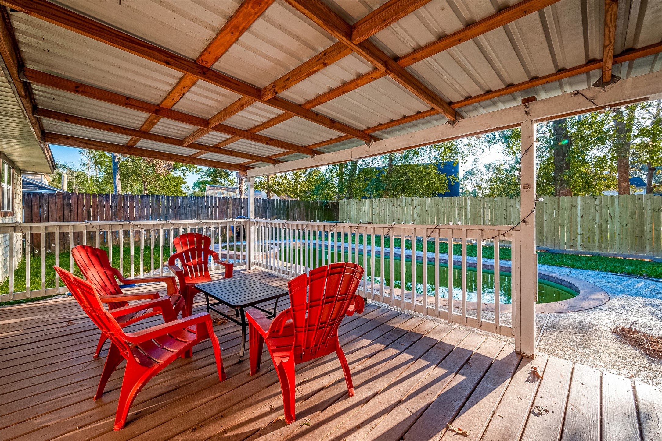 17431 Typhoon Way Crosby, TX 77532 - Photo 31 of 34 a view of a wooden deck with furniture