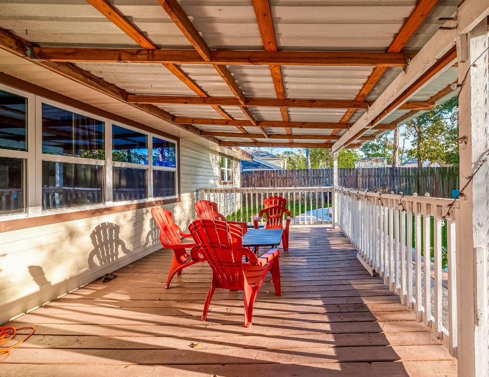 17431 Typhoon Way Crosby, TX 77532 - Photo 32 of 34 a view of a chair and tables in the balcony