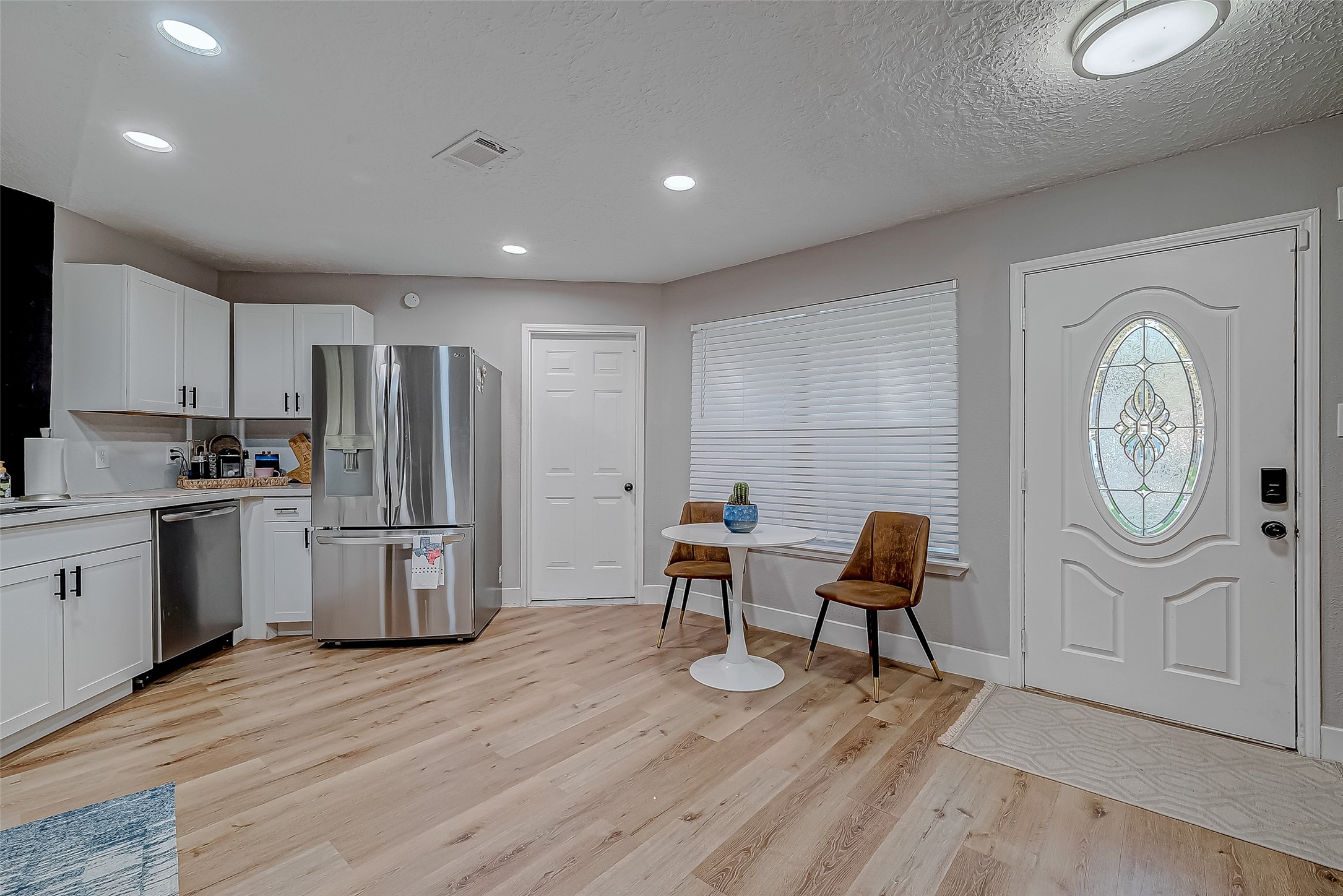 17431 Typhoon Way Crosby, TX 77532 - Photo 7 of 34 a kitchen with stainless steel appliances granite countertop a refrigerator and a stove top oven