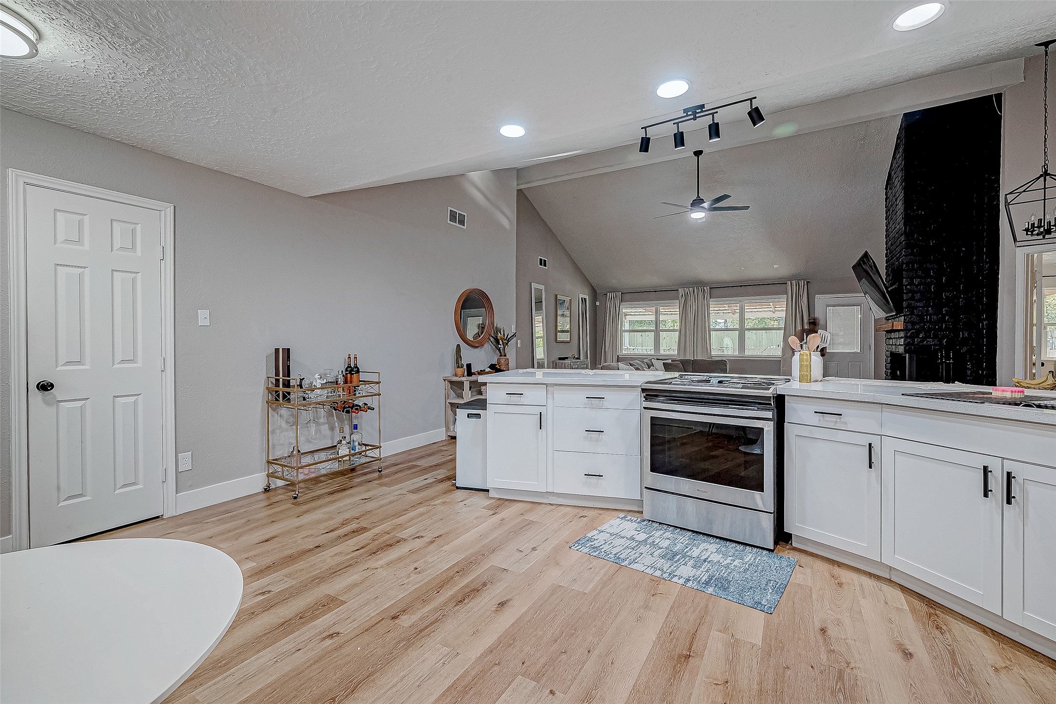 17431 Typhoon Way Crosby, TX 77532 - Photo 8 of 34 a kitchen with a stove a sink and a refrigerator