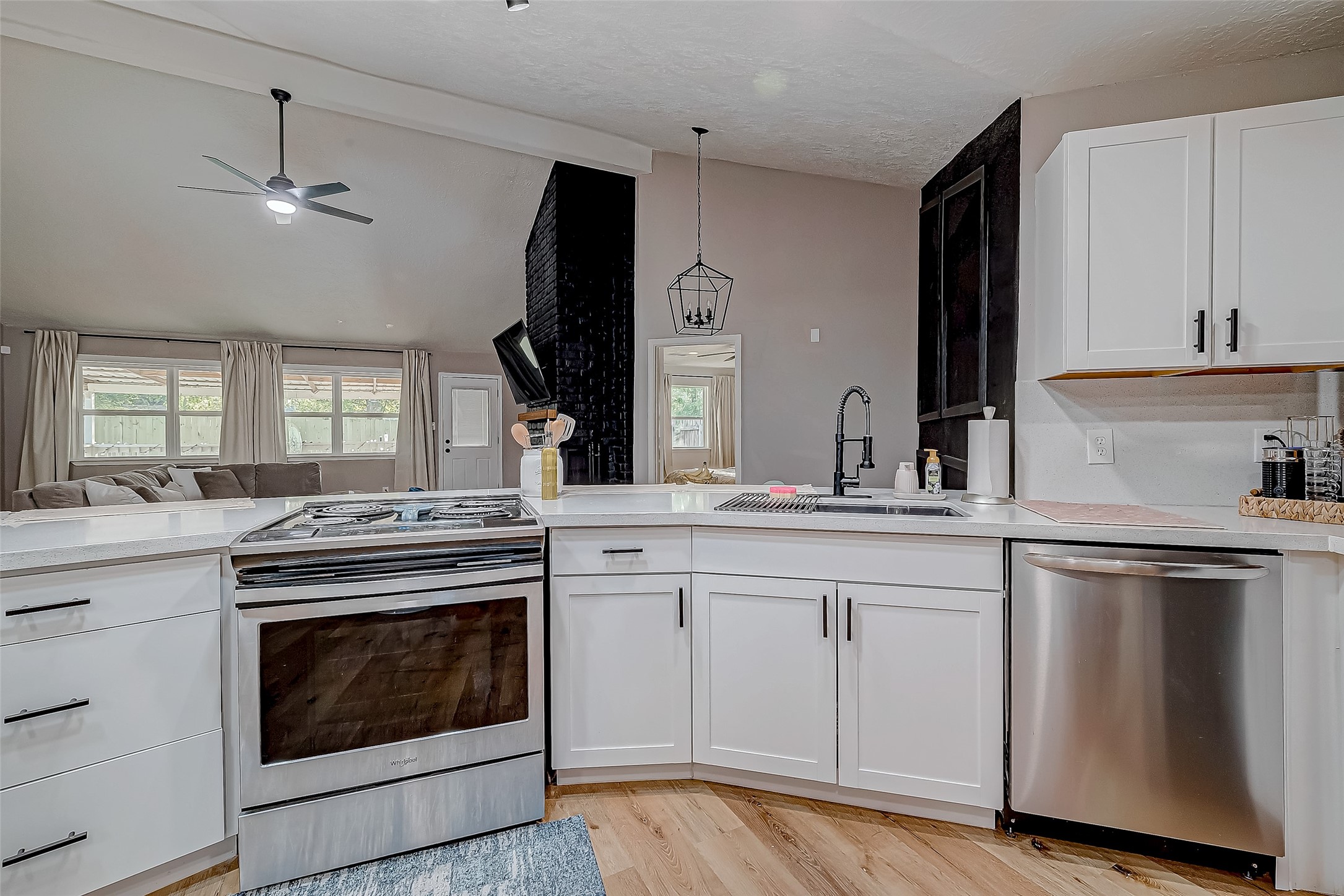 17431 Typhoon Way Crosby, TX 77532 - Photo 9 of 34 a kitchen with cabinets appliances and a sink