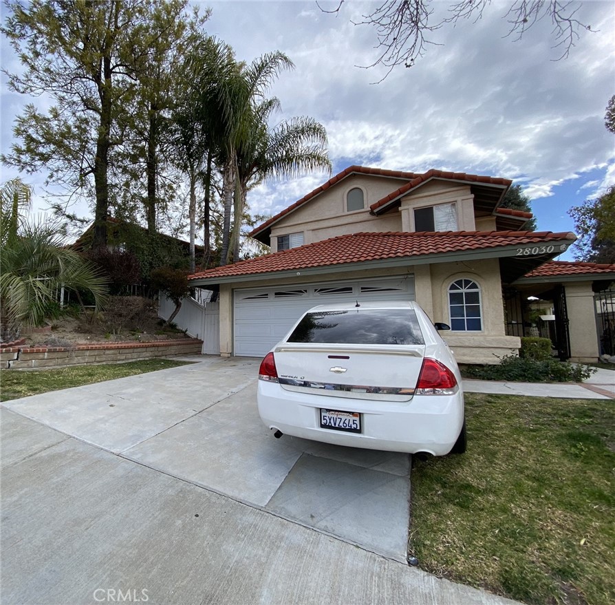 28030 Wildwind Road Canyon Country, CA 91351 - Photo 1 of 1 a car parked in front of a house